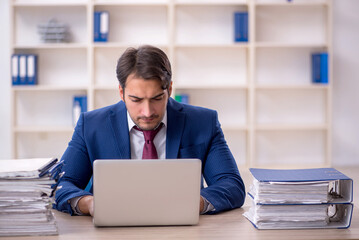 Poster - Young male employee and too much work in the office