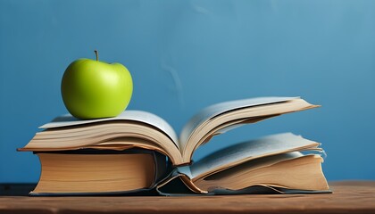 Wall Mural - Celebrating Education with Books and Apples on a Vibrant Blue Background