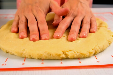 Woman hands roll shortbread dough on table cooking pie on kitchen at home. Ingredient recipe cuisine culinary. Homemade healthy tasty meal, baking. Making preparing domestic dessert.