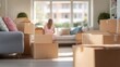 © iNCuteCraffic - A woman sits among unpacked boxes in a bright living room, surrounded by a cozy sofa and natural light, suggesting a recent move or home organization.