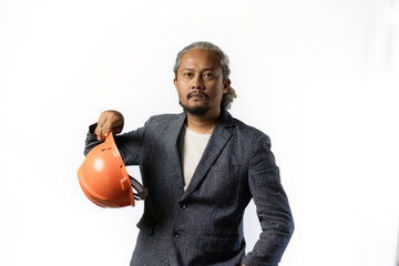 project leaders who look tired and pessimistic. stylish asian man with orange suit and helmet on white background. construction or mining business concept photo