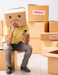 © Elnur - Unhappy man with box instead of his head