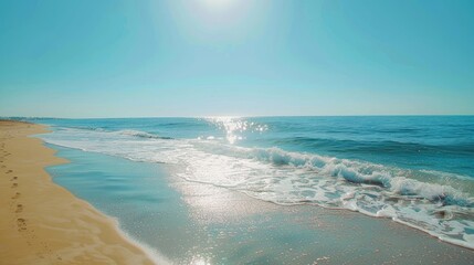 Sunlit summer beach with clear skies.