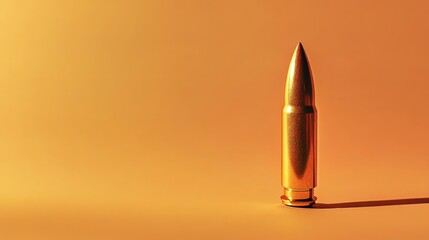 Poster - A single bullet stands upright on a solid pastel orange background, showcasing its metallic surface and intricate details, perfectly framed for commercial use