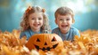 © Diffin - Two happy children smiling while sitting in autumn leaves with a carved pumpkin in a bright outdoor setting.