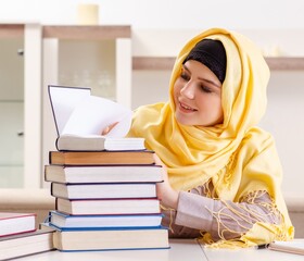 Wall Mural - Female student in hijab preparing for exams