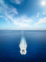 Wall Mural - aerial front view of a modern luxury yacht sailing over the ocean with high speed