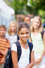 Portrait, learning and smile with girl at school for education, growth and future development. Students, knowledge and youth with child studying at STEM academy for class, montessori and campus