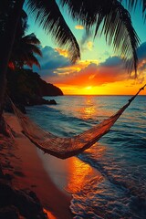 Poster - A hammock hanging from a palm tree on the beach at sunset