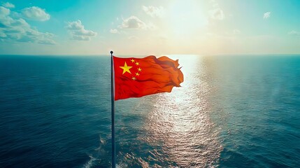 Poster - A chinese flag flying high above the ocean at sunset