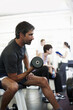 © STEEXBuyout/peopleimages.com - Fitness, training and man with weights in gym for bodybuilding, workout and challenge in morning. Serious, athlete and male person with equipment in health club for strength, exercise and wellness