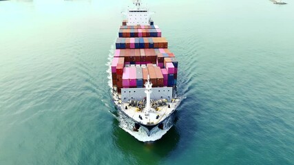 Wall Mural - Cargo container ship carrying container and running out international container port customs shipyard sea port concept smart logistic service. Portrait video Container Ship.	