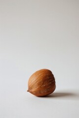Poster - A single nut isolated on a white background, suitable for use in product or industrial photography