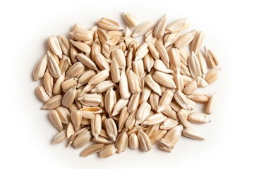 Aufkleber - A pile of sunflower seeds on a white surface, ideal for use in still life photography or as a prop for food and drink imagery