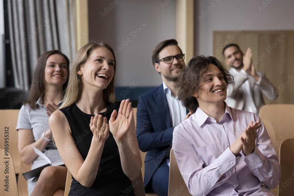 Happy inspired conference participants applauding speaker, thanking ...