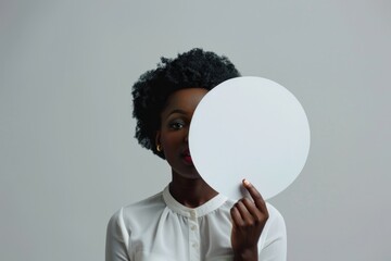 Poster - A woman holds a white paper circle in front of her face, possibly hiding or concealing herself