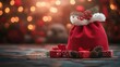 © Katsiaryna - red santa claus bag with gifts on sparkling background. banner with copy space