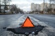 © DK_2020 - Asphalt patch, warning triangle, city road