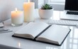 © vvicca - Table with a notebook and candles