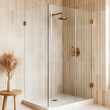 © Photography09 - Frameless glass shower with brass fixtures and beige tiles, minimalist bathroom aesthetic, modern luxury