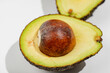 © Jakob - Avocado with brown pit. The avocado is cut in half and the pit is visible inside.
