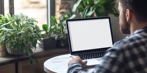 Canvas Print - Men are seen working at home, each using a laptop computer with a blank white desktop screen. This setup presents an opportunity for technology mockups, communication, marketing, and design