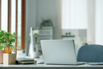 Wall Mural - Serene and organized home office with laptop placed on a white desk.