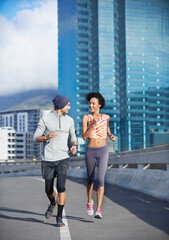 Canvas Print - Bridge, smile and couple with running for fitness, endurance or health benefits with training on road. City, man and woman with support for cardiovascular exercise, burn calories or pace for wellness