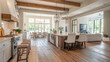 © PRIMPROW - Spacious open concept room with a modern farmhouse design. White walls, wooden accents, and a large kitchen island make the space inviting and functional.