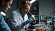 © Puchong - Scientists working in a laboratory with microscope.