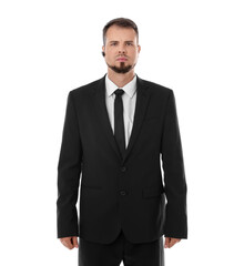 Wall Mural - Young bodyguard in suit with earpiece isolated on white