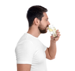 Wall Mural - Handsome man drinking water with lemon on white background