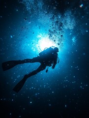 Wall Mural - Diver exploring the deep ocean waters with sunlight filtering through in a captivating underwater environment