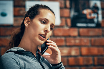 Aufkleber - Face, fitness and phone call with personal trainer woman in gym for communication or networking. Brick wall, exercise and workout coach talking on mobile for membership offer or recruitment