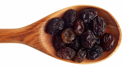 Raisin grain in wooden spoon closeup view