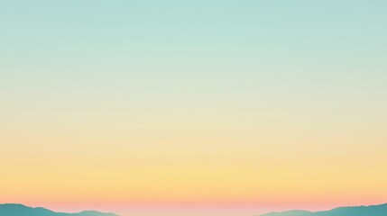 Wall Mural - clear sky with a gradient from light blue to warm yellow at the horizon