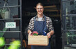© Frank Coop/peopleimages.com - Man, portrait and open sign at flower store, small business and owner for plant nursery at entrance. Male person, retail manager and board in window for service, professional and pride in Scotland