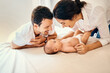 © SensSai/peopleimages.com - Parents, happy and baby for care, development and bonding with support, love and relax in home. Newborn, family and smile for connection, growth and nurture with protection, play and people in house