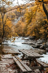 Wall Mural - Wooden Picnic Table By A River In The Fall