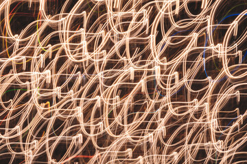 Poster -  image is a blurry, colorful, and abstract representation of a pattern. The colors are bright and the lines are wavy, giving the impression of movement and energy. Scene is dynamic and lively