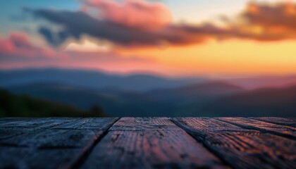 A wooden table with a blurred background of a breathtaking sunset and mountains