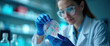 © 2April - Cell Therapy Research: Scientist Examining Petri Dish with Microorganisms in a Lab