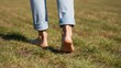 © ANDREY PROFOTO - Close-up of bare feet walking outdoors