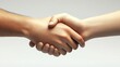 © Aris Suwanmalee - A close-up of two hands shaking in a gesture of agreement, collaboration, and unity against a soft, neutral background.