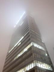 modern office buildings in fog