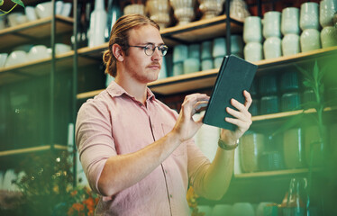 Poster - Man, tablet and inventory check at flower shop, small business and entrepreneur for online store. Male person, reading customer review and app to monitor stock, nursery and internet to sell product