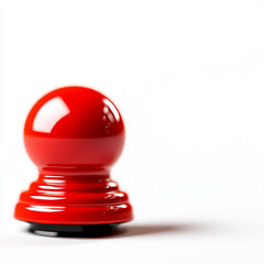 A vibrant red game piece resting on a clean white surface, perfect for board game concepts and playful themes.