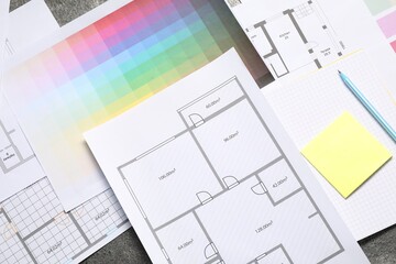 Poster - Designer's workplace with house plans, color palettes and stationery on table, flat lay