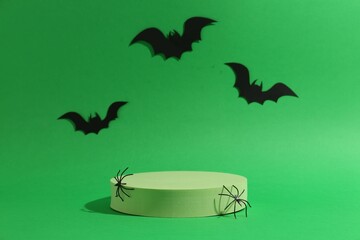 Canvas Print - Presentation of product. Podium and Halloween decor on green background. Space for text