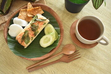 delicious and delicious grilled rice food menu wrapped in banana leaves. Baked rice is a traditional Indonesian food.